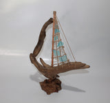 Driftwood Boat with Light Blue Sail