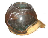 Glass vase on wooden hand